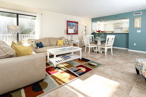 Gulfside 203:WRAP AROUND BALCONY, GORGEOUS UPGRADES - FLOORING AND FURNITURE!